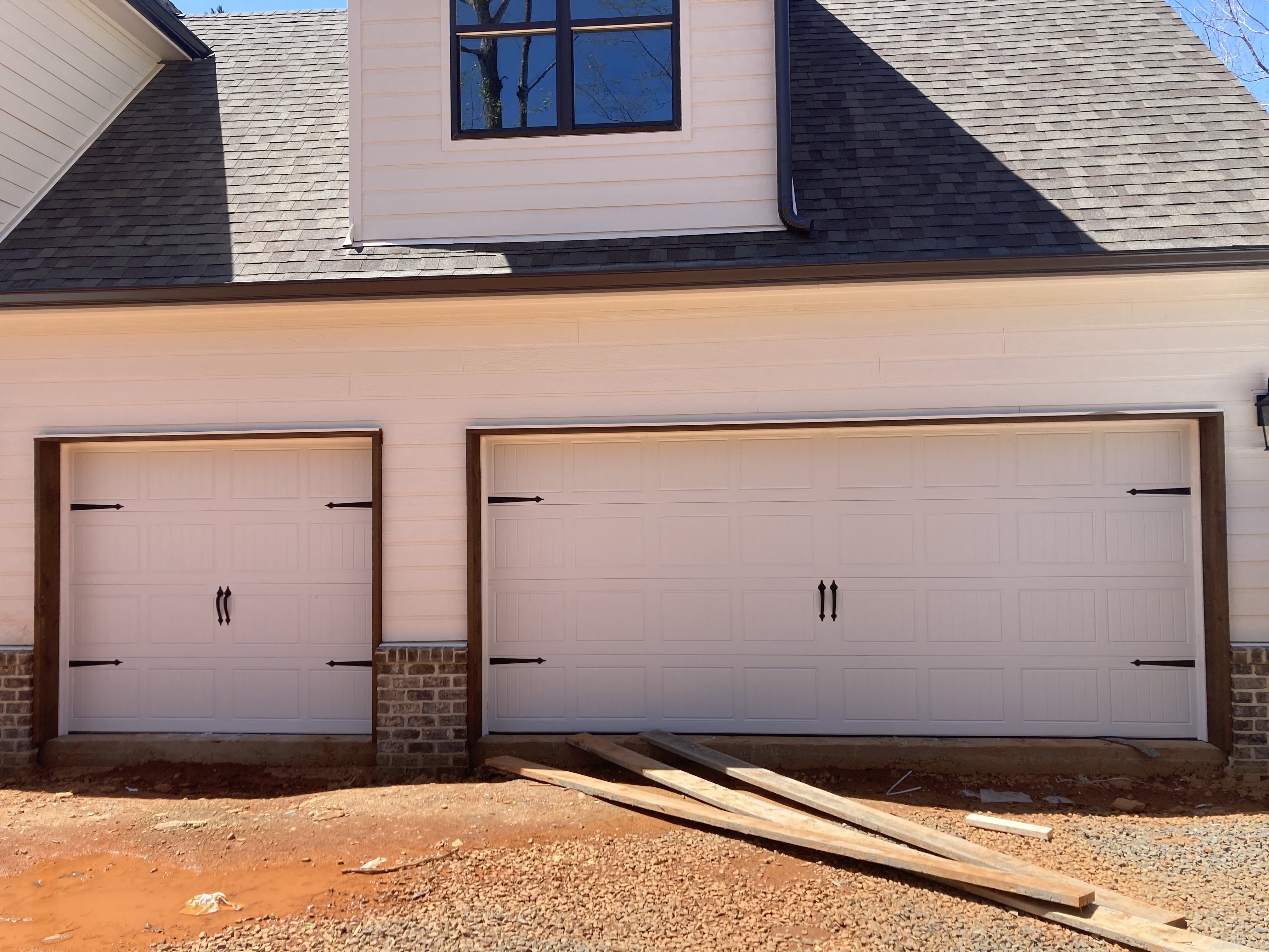 White carriage house garage door with black hardware