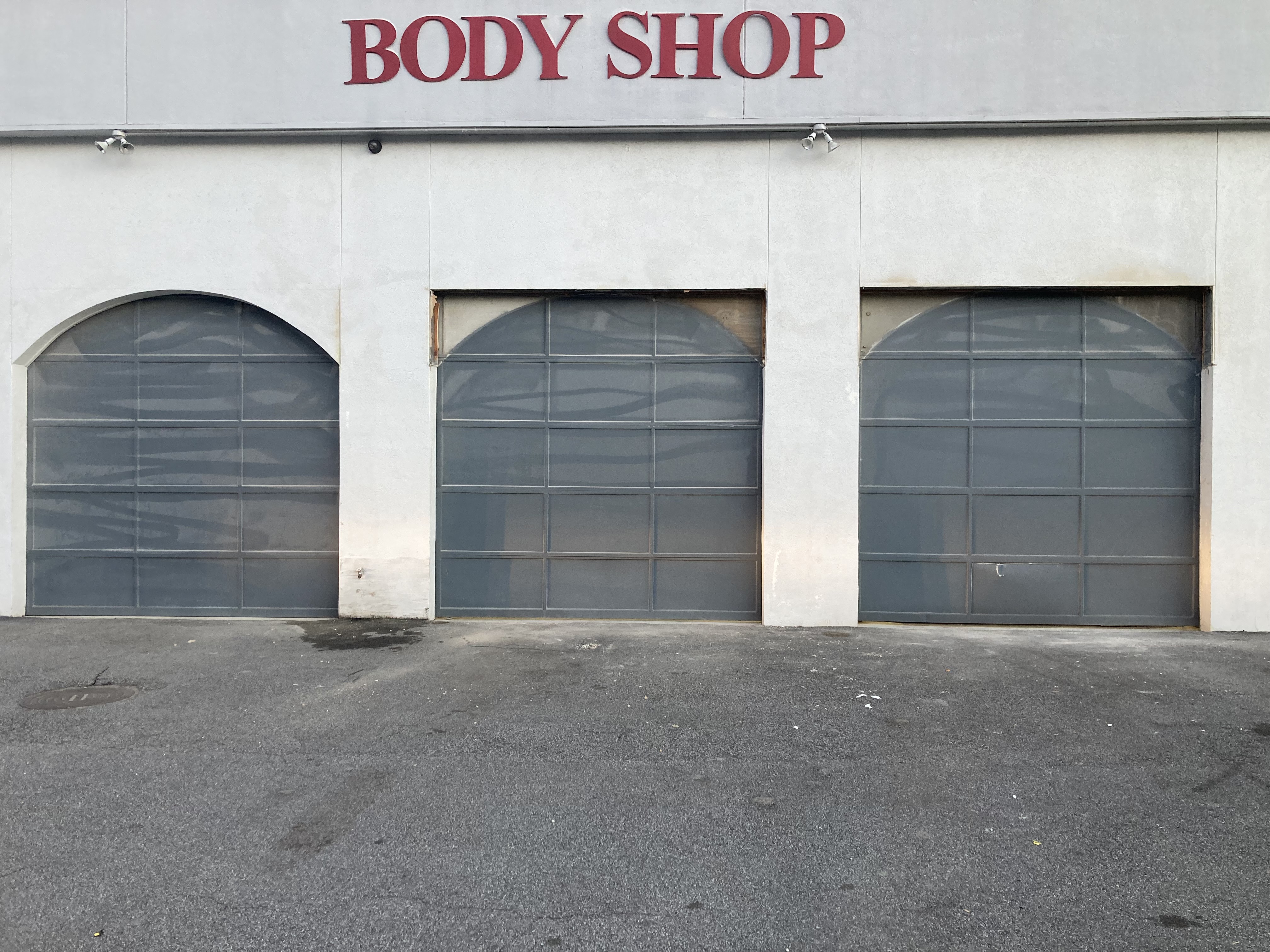 Commercial garage doors for body shop service bays