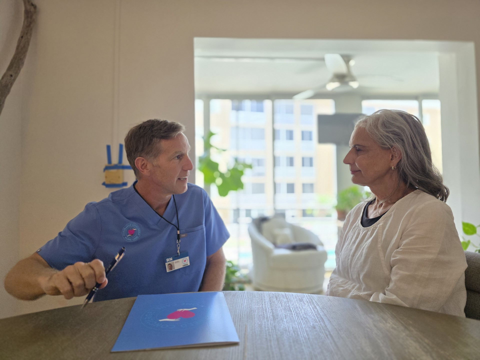 NURSENEED nurse meeting with a client in her home