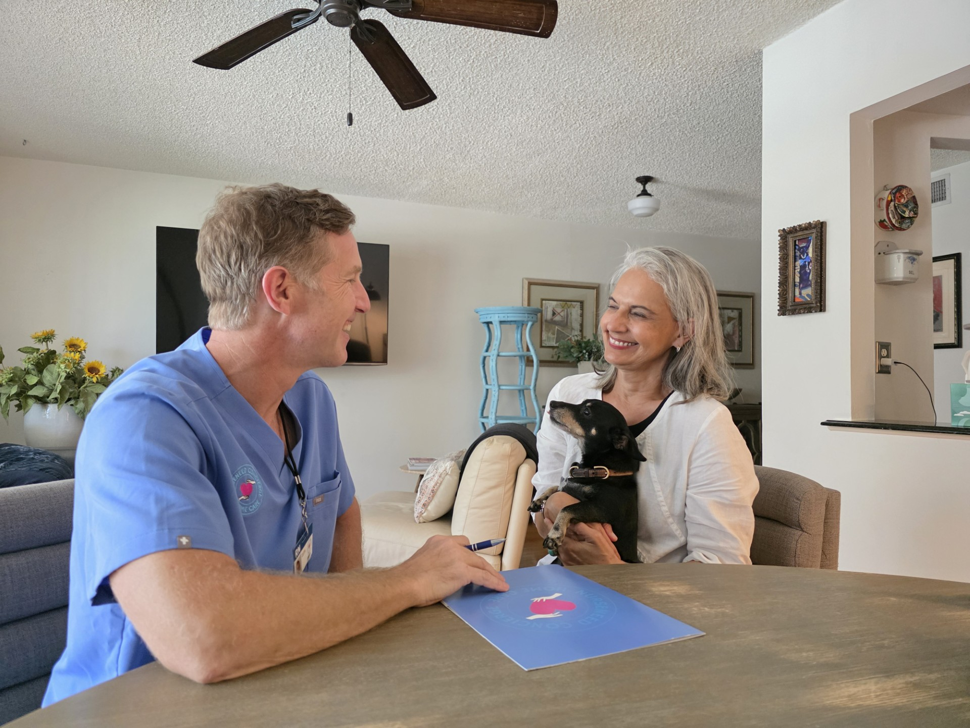 NURSENEED nurse discussing personalized skilled nursing care with a client at home