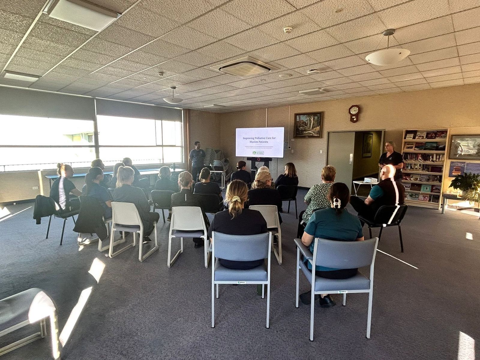 Audience at a community talk on palliative care