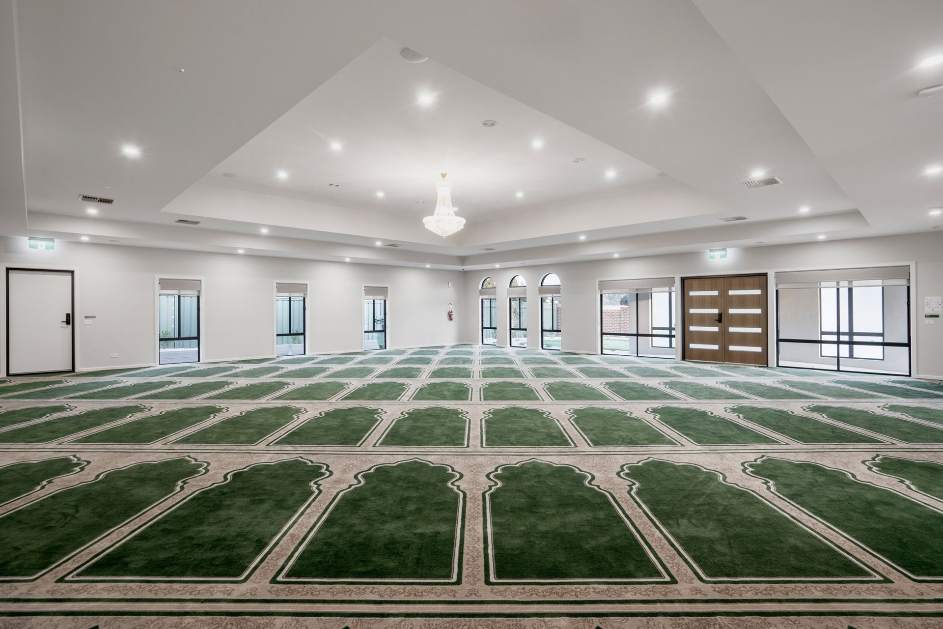 The main prayer hall with green carpet