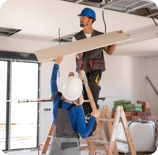 man repairing the roof of the office