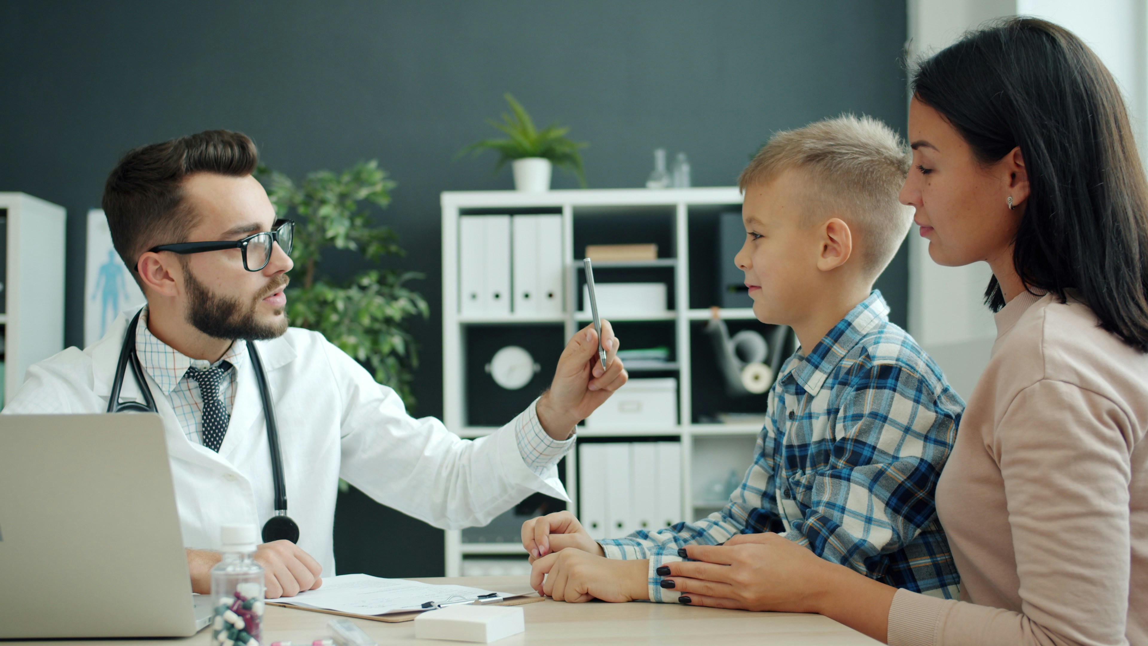 Doctor with patient in medical clinic — healthcare practice that depends on appointment booking and reminders