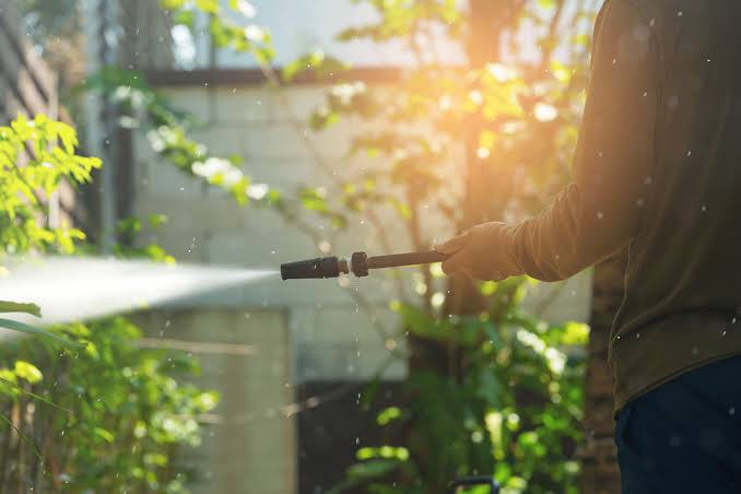 Soft pressure washing of home exterior siding