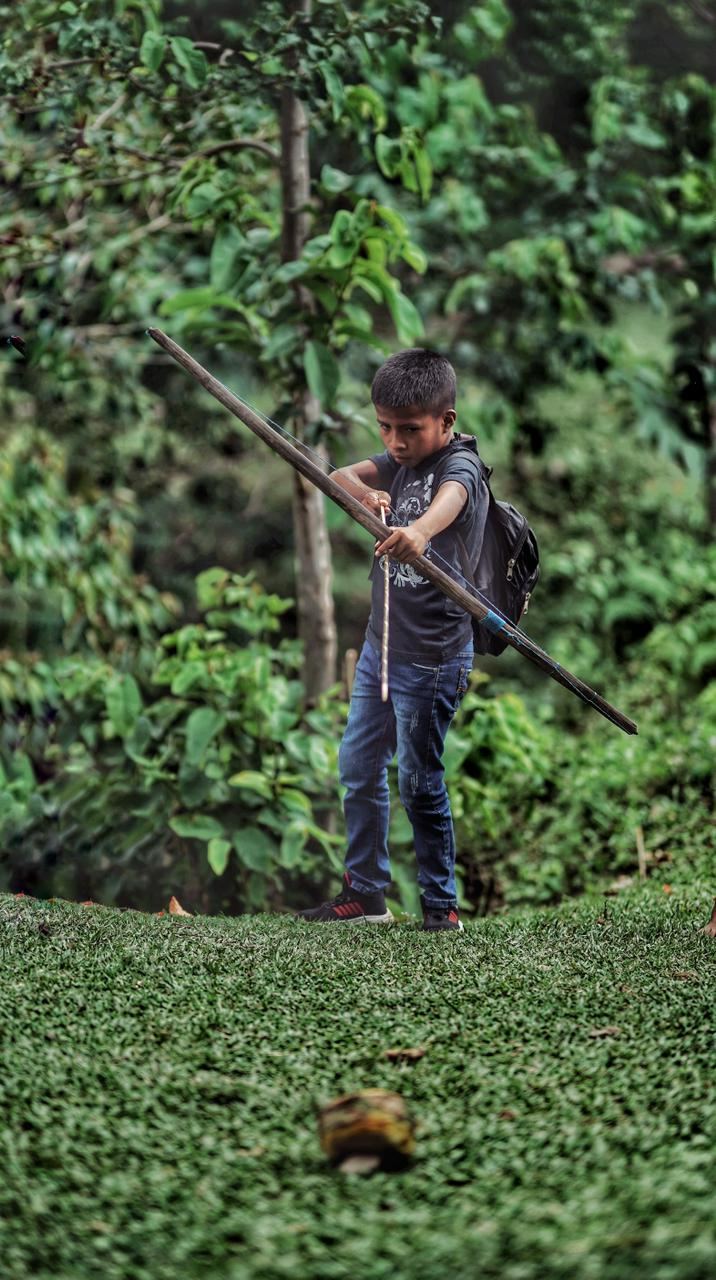 A young man with a bow