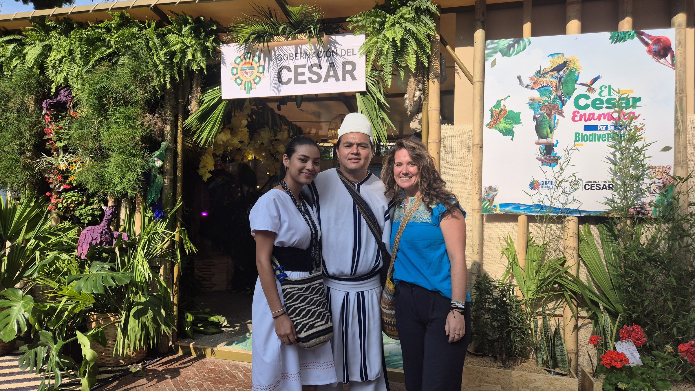 Two members of the Dumizay family with Genevieve at the Cesar pavilion, COP16, Cali