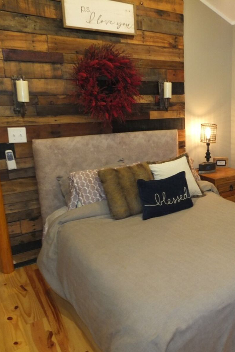 woman setting sheets on bed