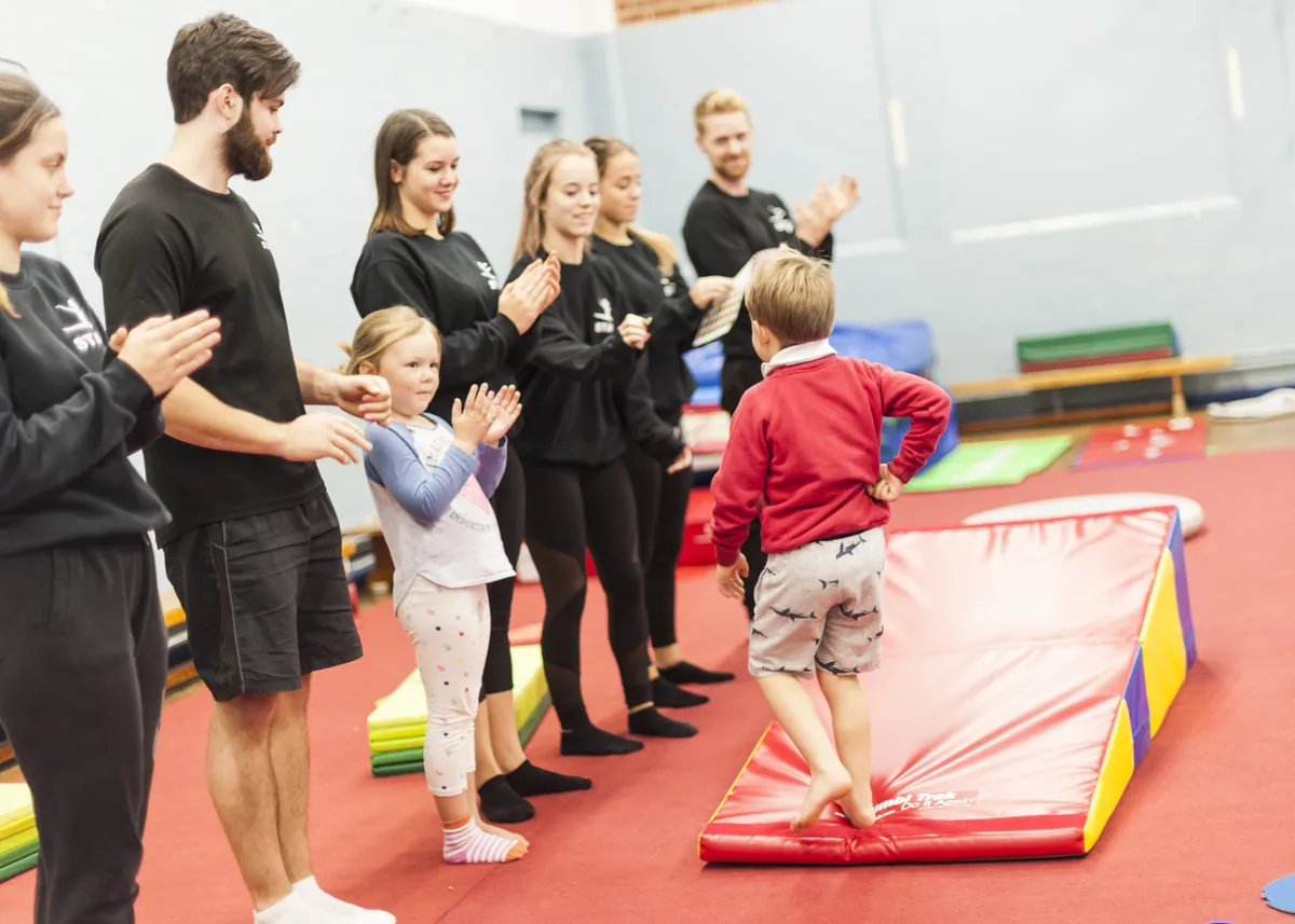 Good Life coaches with children in class