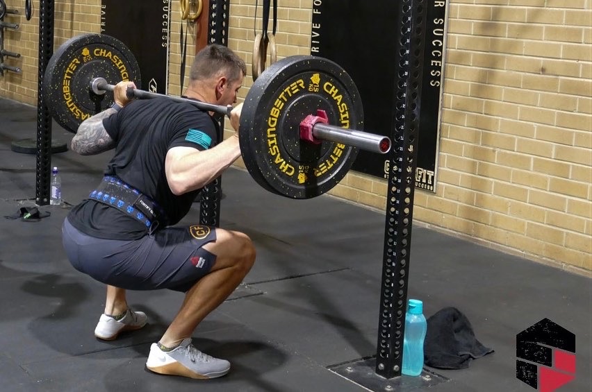 Heavy back squat during a CrossFit class