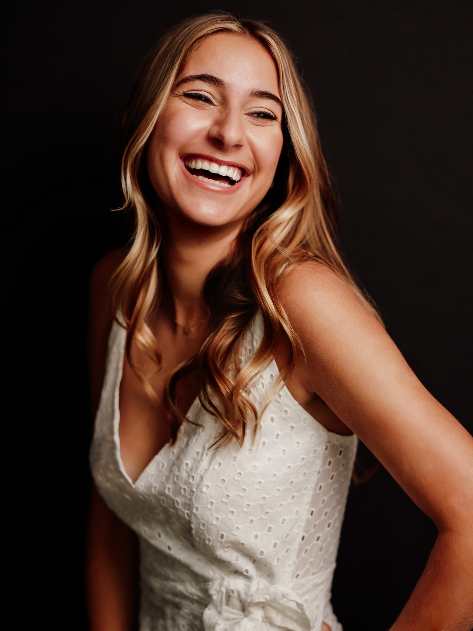 High school senior laughing during her portrait session