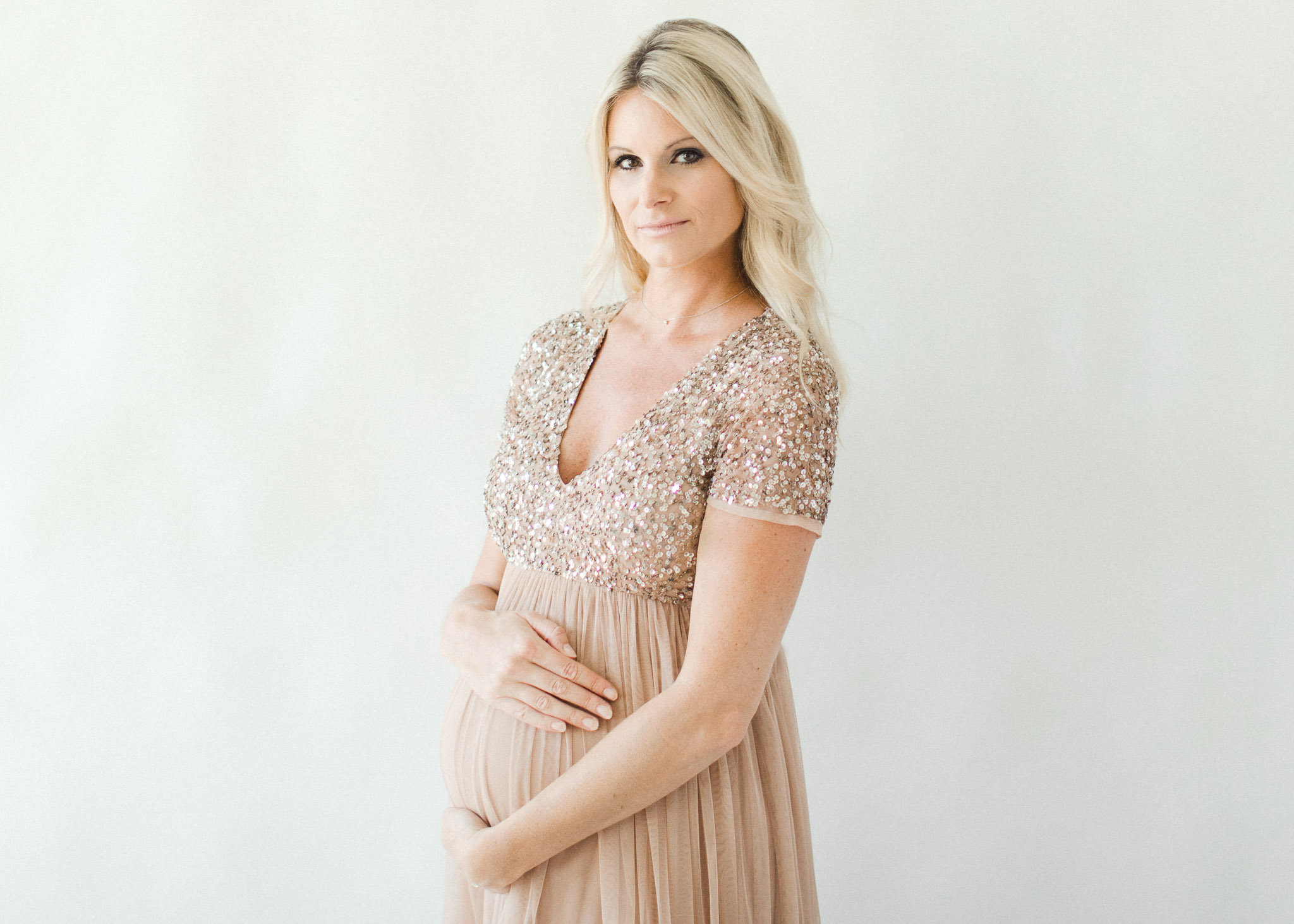 Maternity portrait in champagne gown