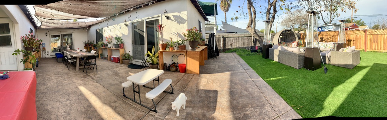 “Outdoor courtyard and backyard lounge area at Casa Sur Hacienda in the San Diego South Bay, featuring shaded seating, patio dining tables, plants and cozy gathering spaces — ideal for retreats, workshops, family stays and group events in Chula Vista, California.