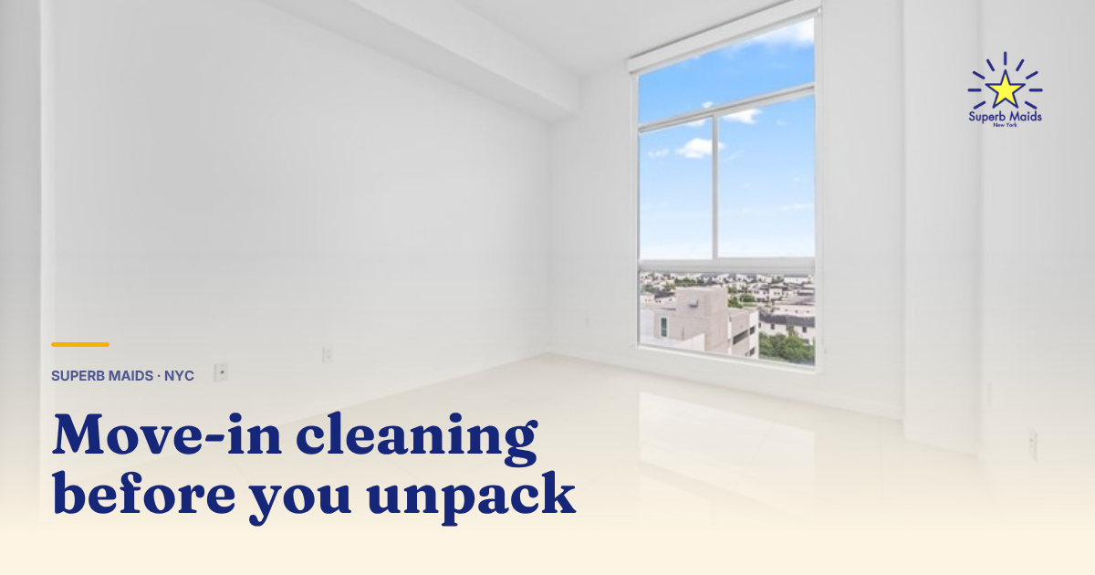 Cleaner wiping inside an empty kitchen cabinet during a move in cleaning NYC apartment turnover