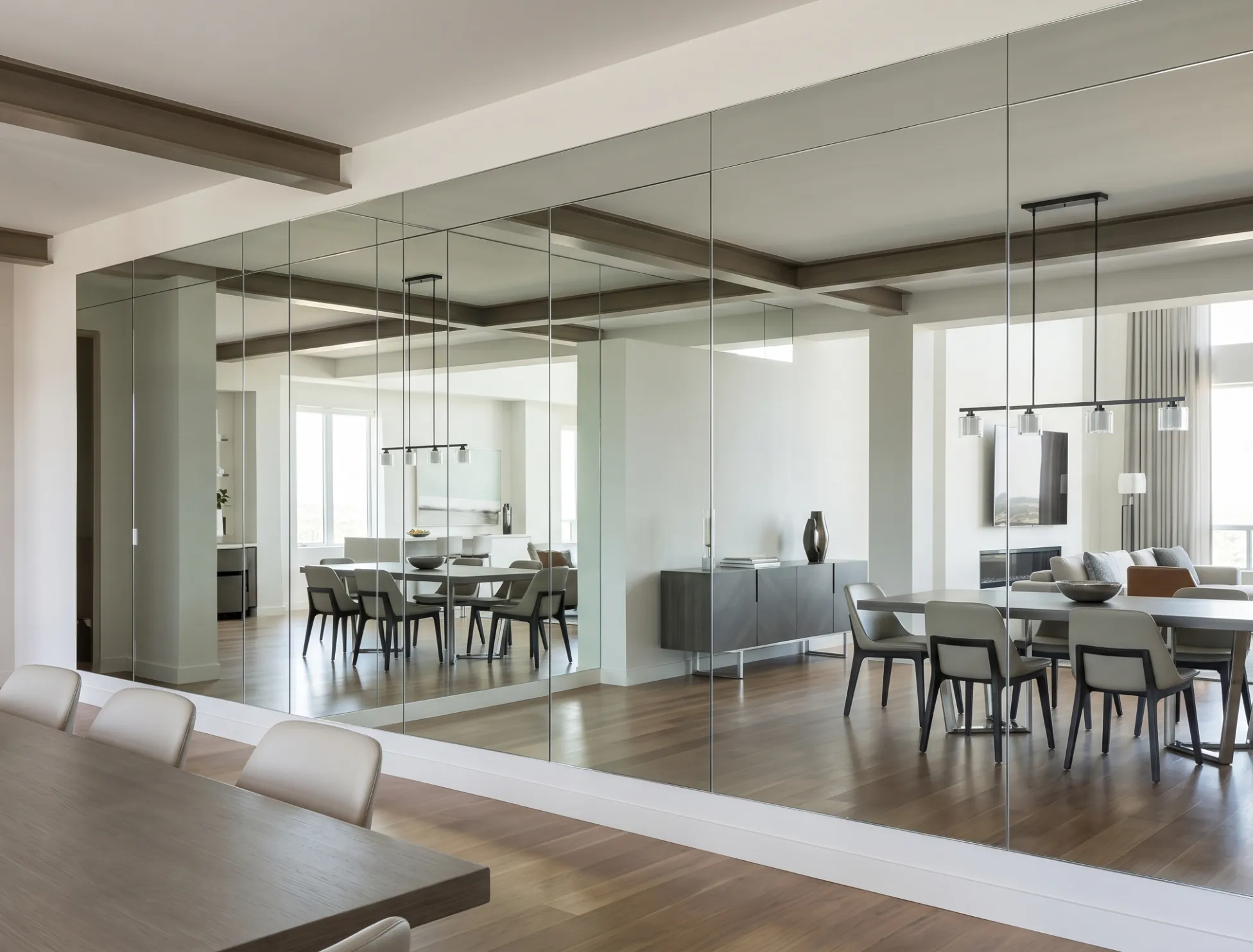 Large-scale custom full wall mirrors aligned for a continuous, high-end reflection