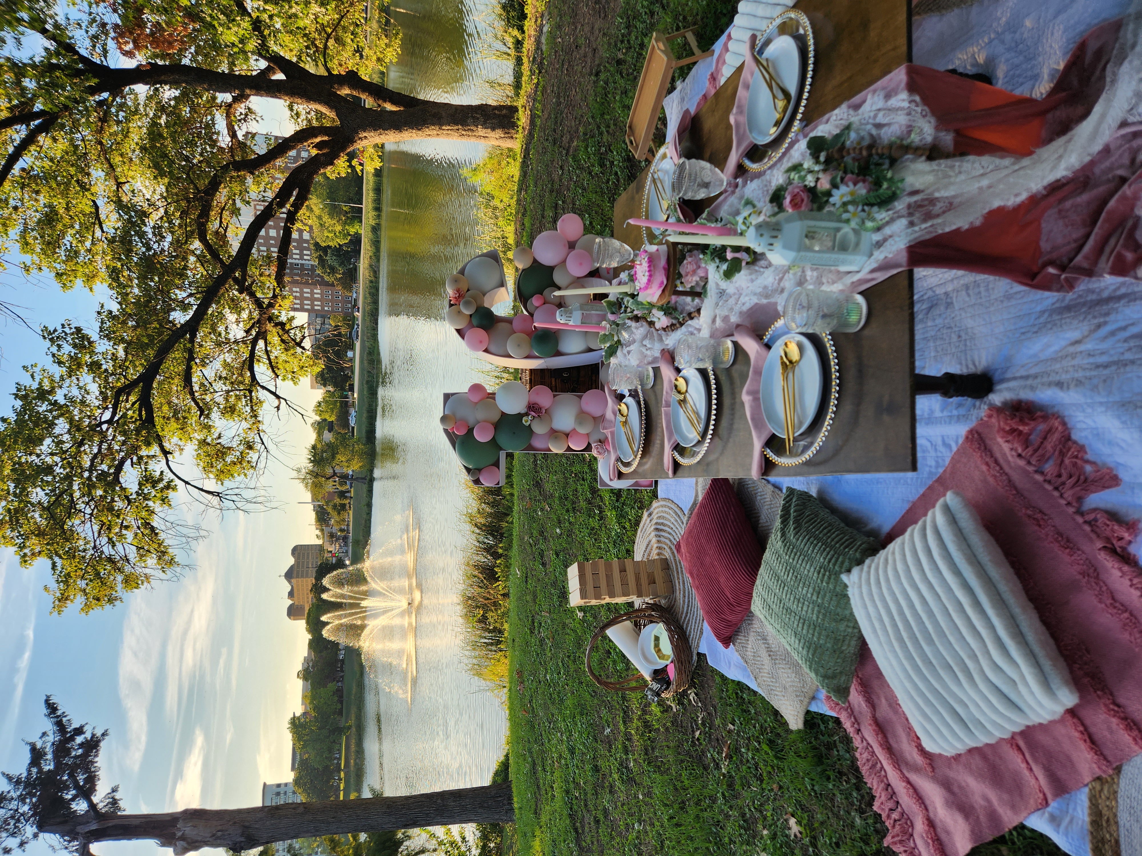 Lakeside luxury picnic at sunset with blush theme