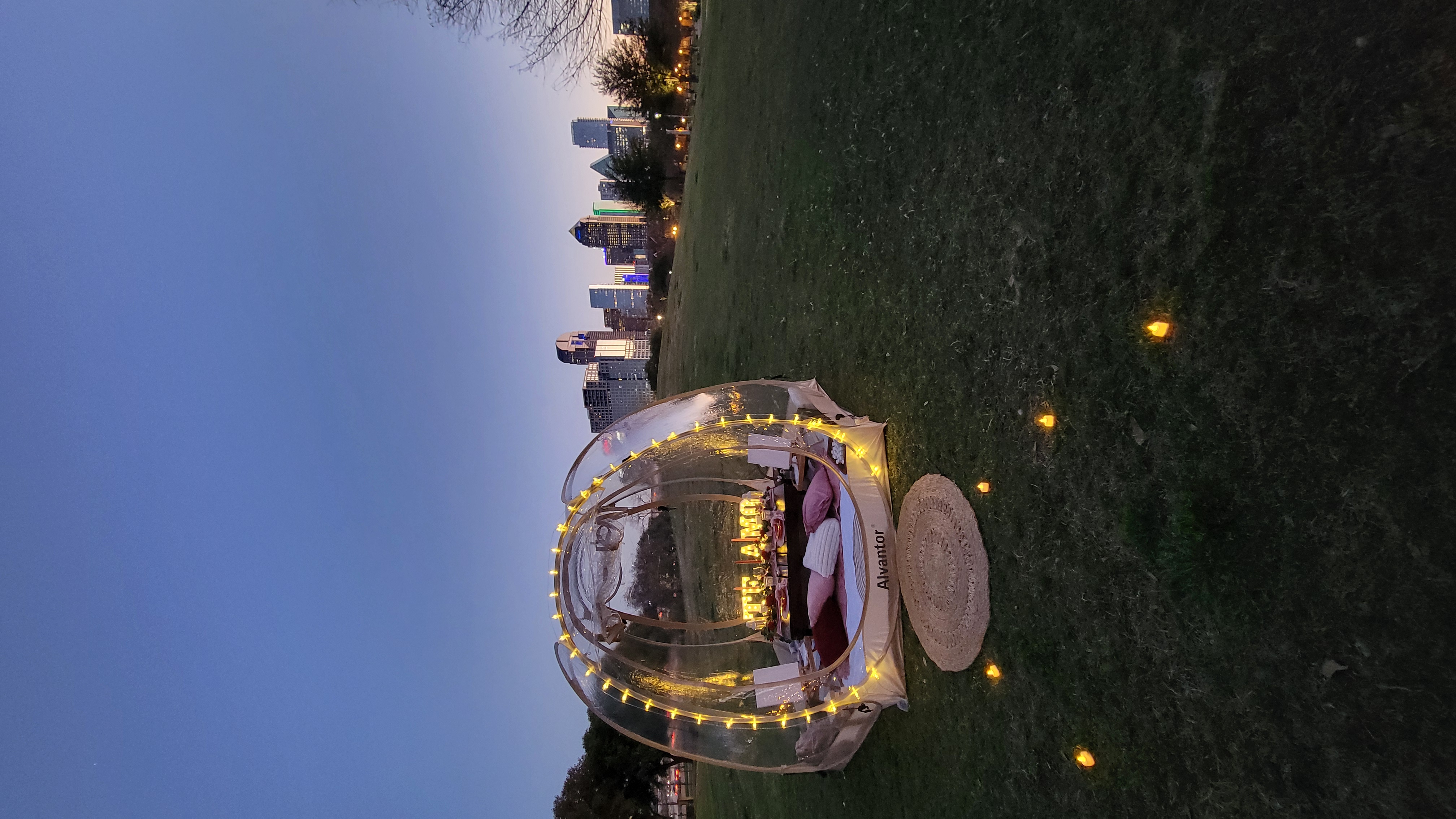 Bubble dome picnic with Dallas skyline