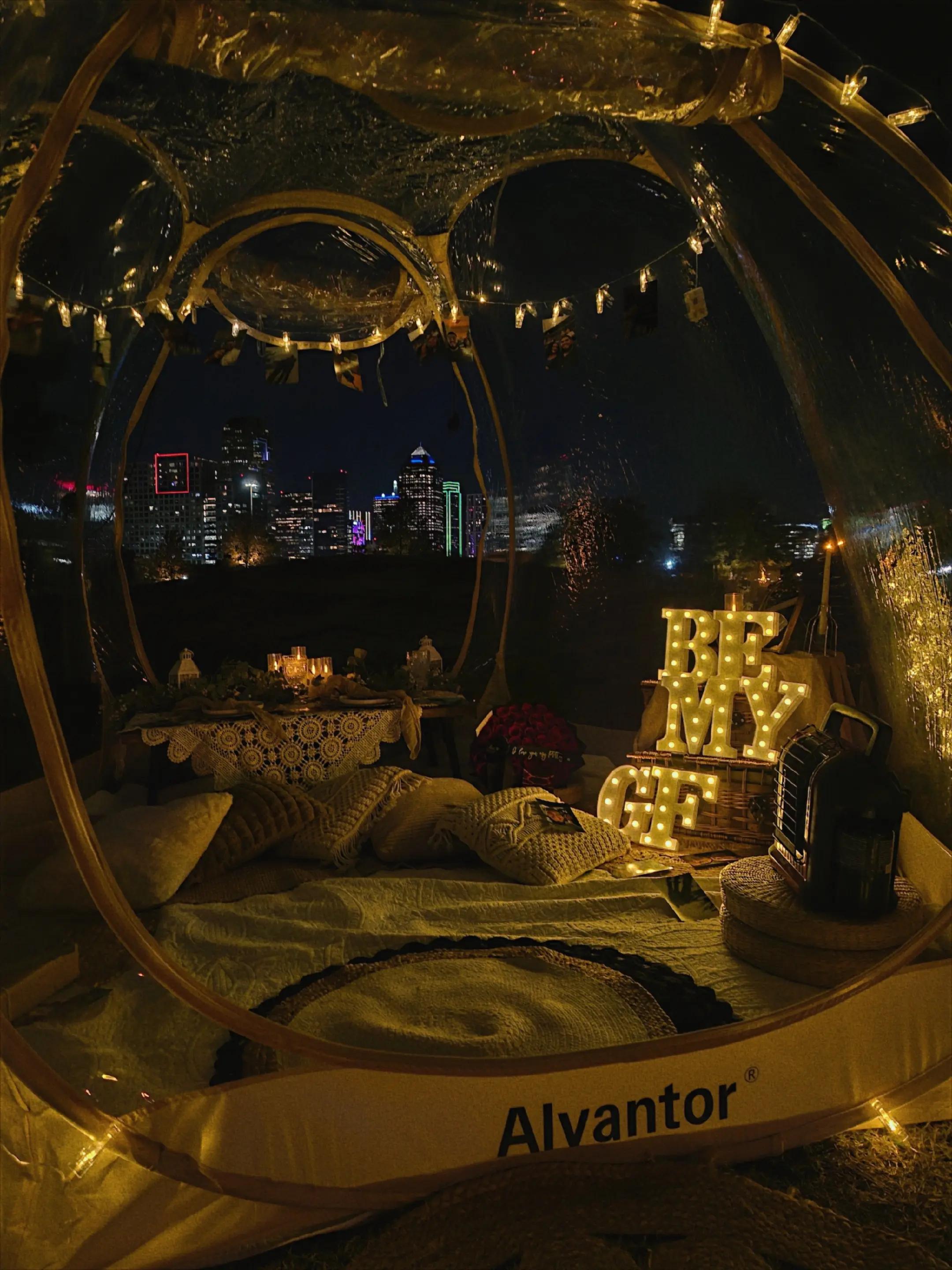 Be My GF bubble dome picnic at night with the Dallas skyline