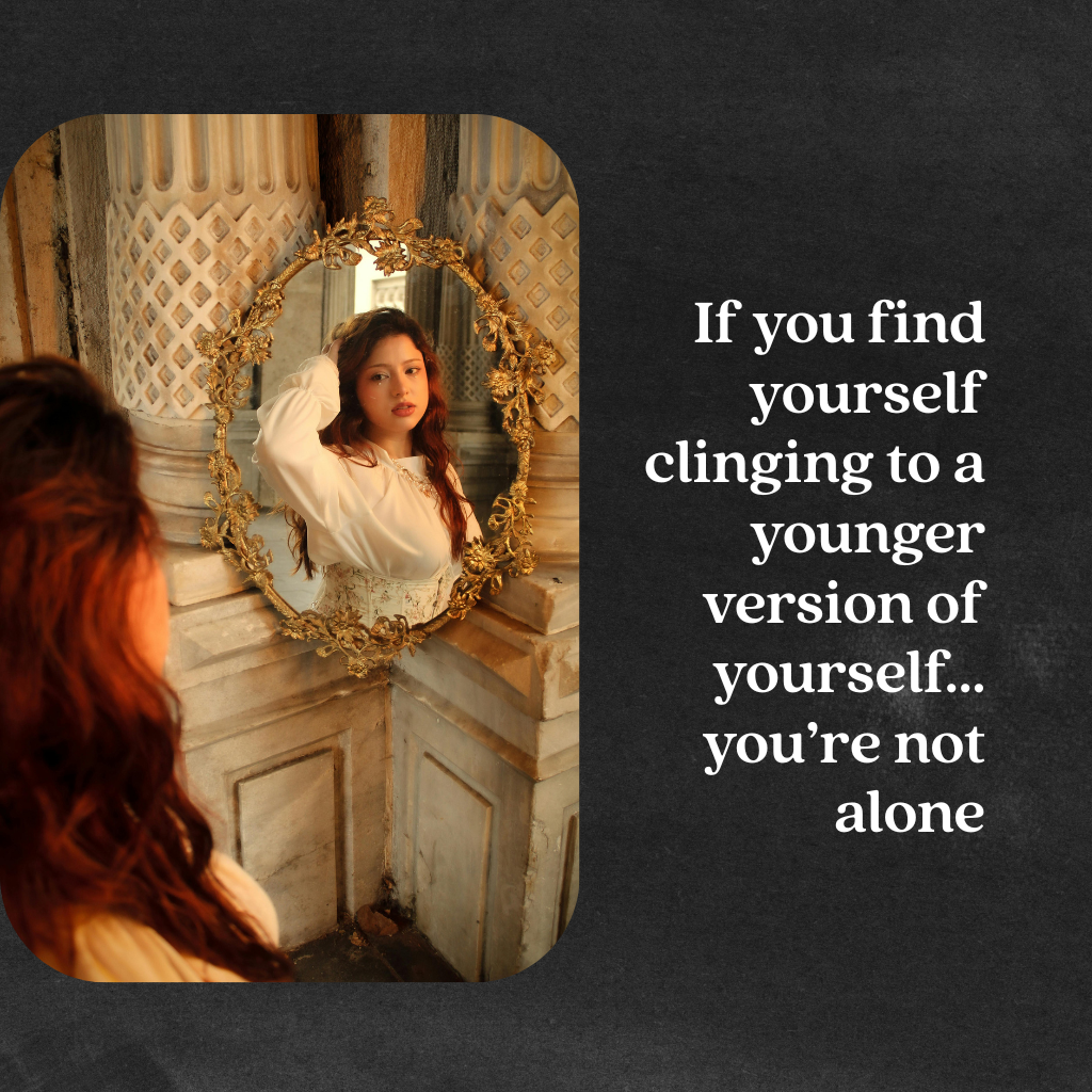 An image of a woman looking back at a younger versionn of herself in the mirror with the quote "if you find yourself clinging to a younger version of yourself, you're not alone"