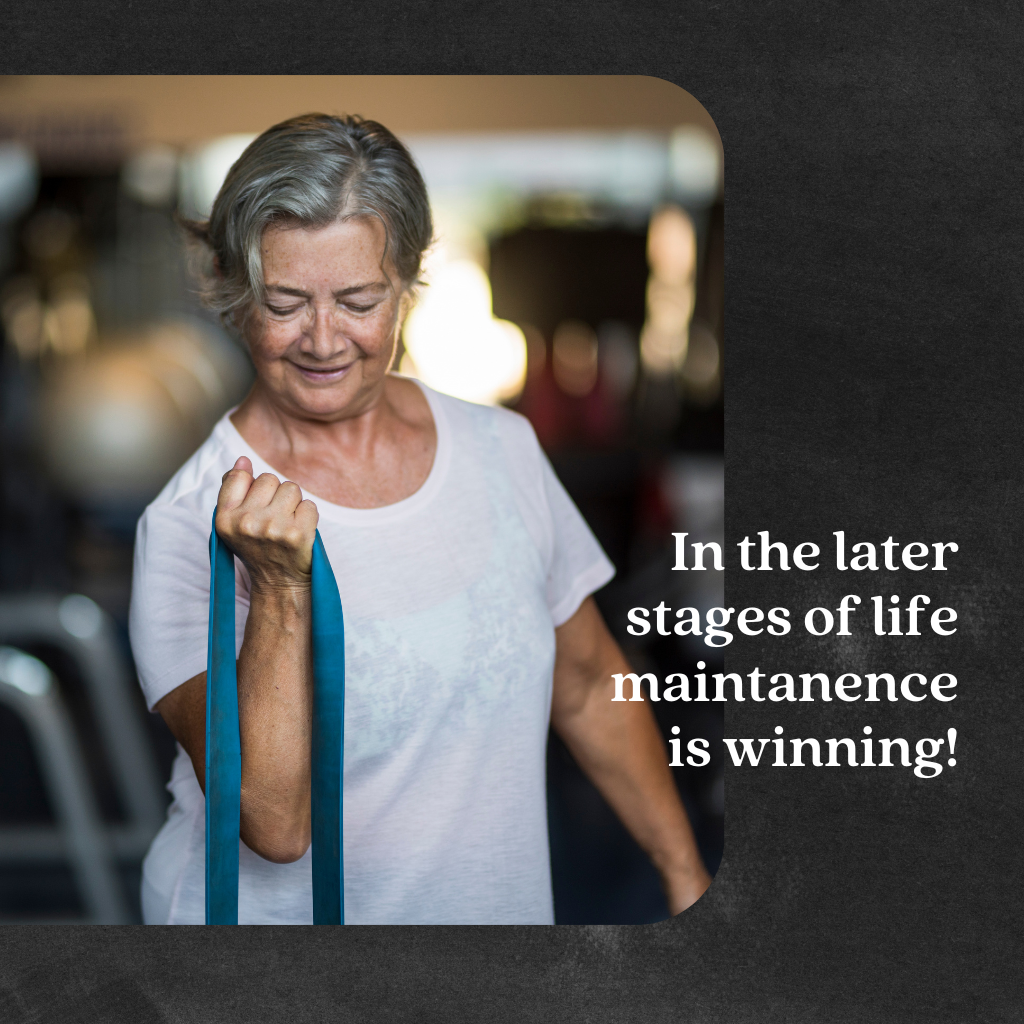 An older woman performs resistance band exercises in a gym, with the text overlay: "In the later stages of life, maintenance is winning." Episode 131 of Rooted in Presence — Lead With Your Bones Part 2, on strength training and bone health for midlife women An older woman performs resistance band exercises in a gym, with the text overlay: "In the later stages of life, maintenance is winning." Episode 131 of Rooted in Presence — Lead With Your Bones Part 2, on strength training and bone health for midlife women