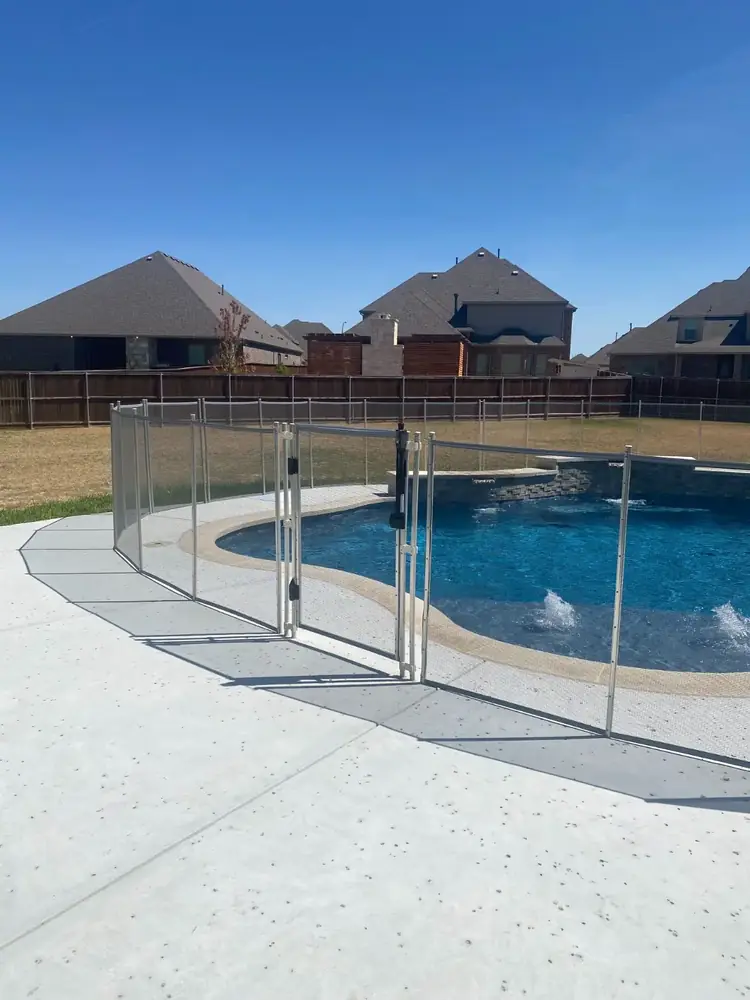 Gray mesh safety fence with silver poles