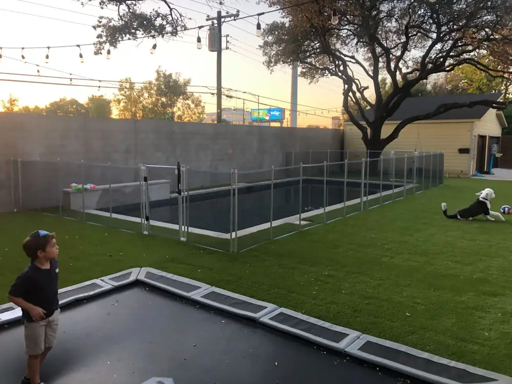 Gray mesh safety fence with silver poles