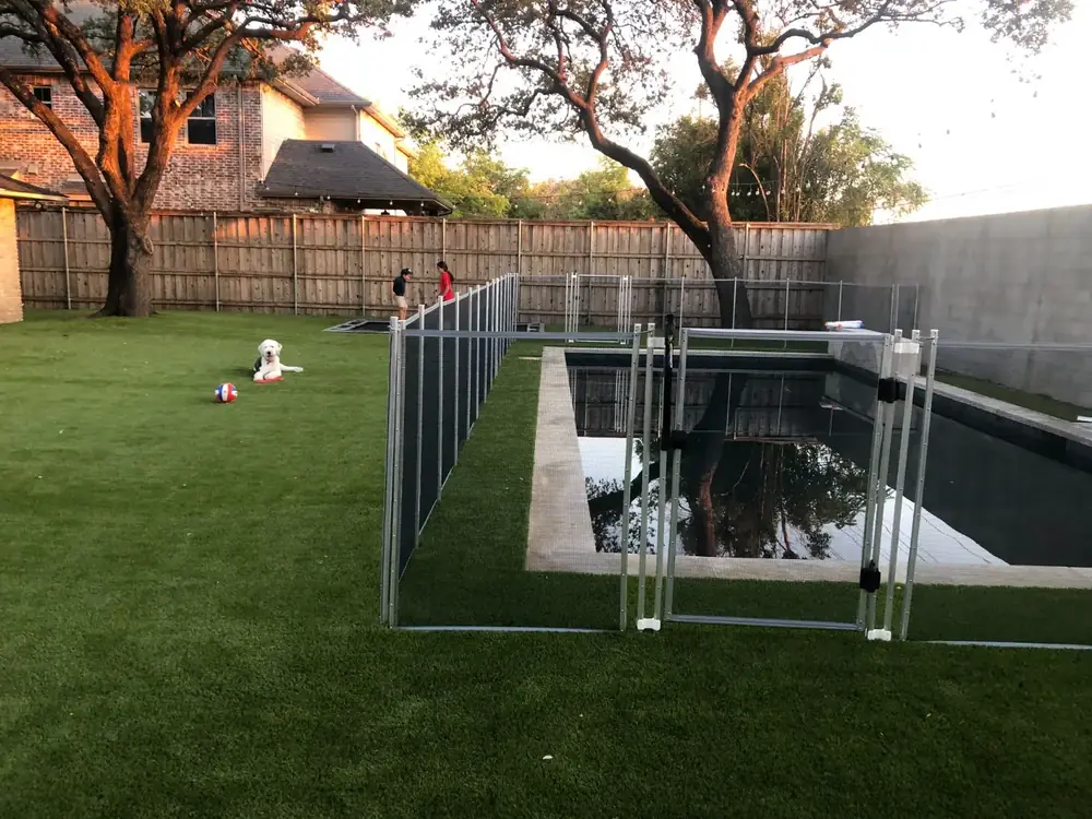 Gray mesh safety fence with silver poles