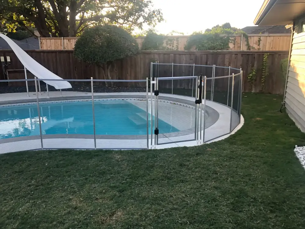 Gray mesh safety fence with silver poles
