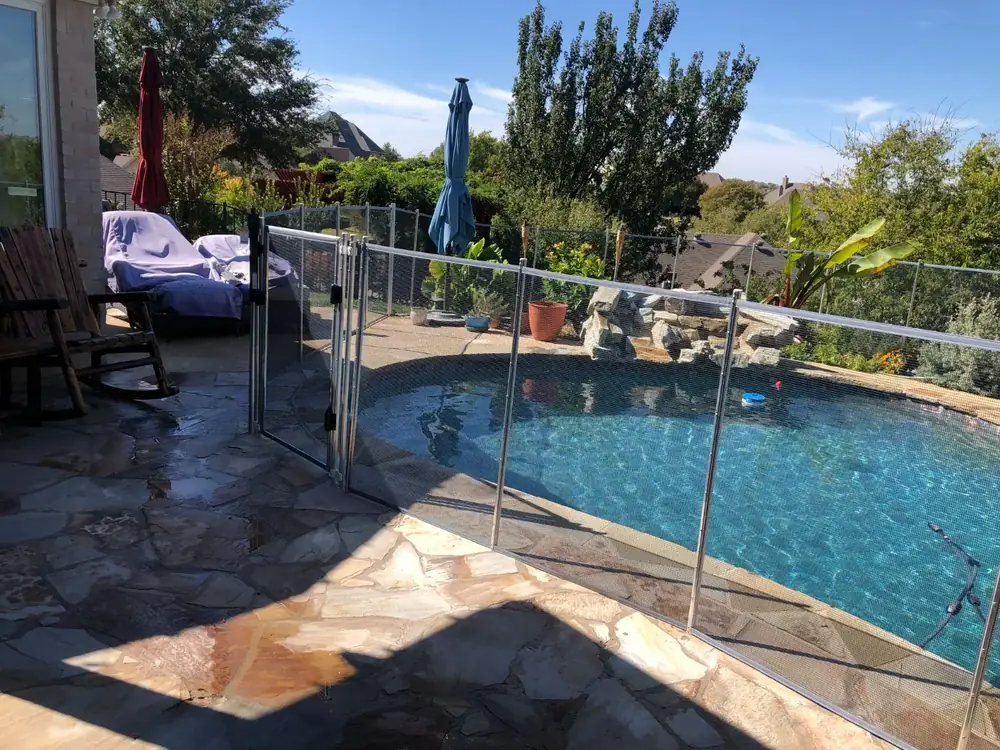 Gray mesh safety fence with silver poles