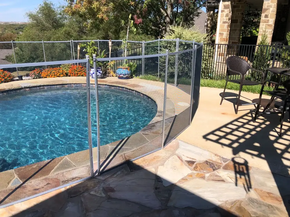 Gray mesh safety fence with silver poles