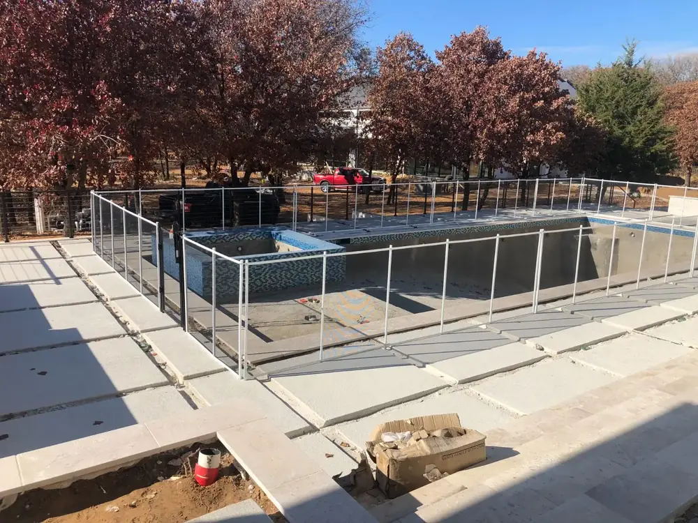 Gray mesh safety fence with silver poles