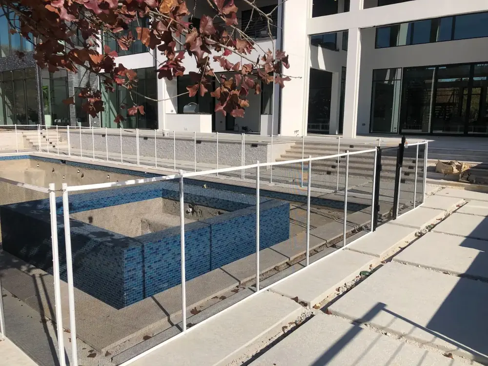 Gray mesh safety fence with silver poles