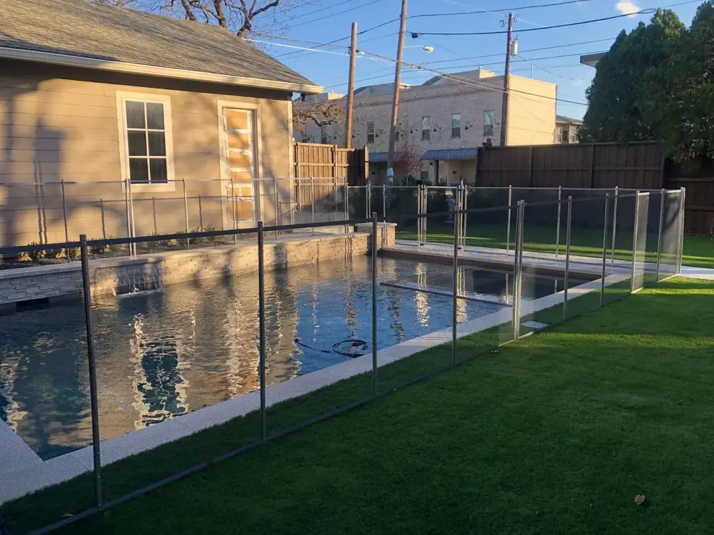 Gray mesh safety fence with silver poles