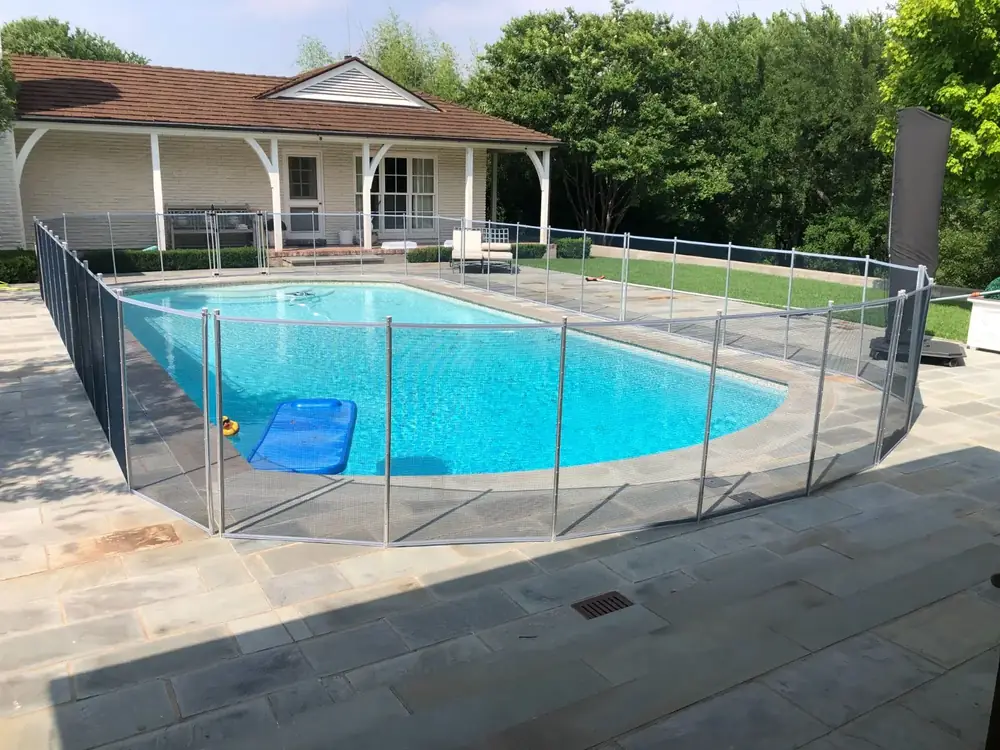 Gray mesh safety fence with silver poles
