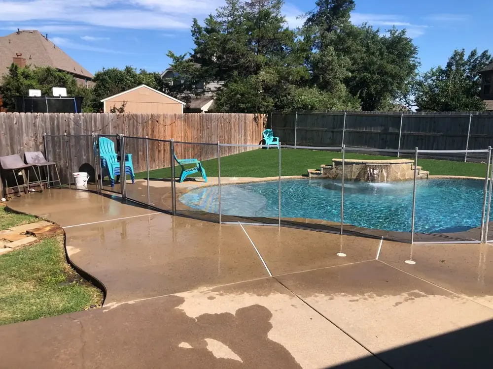 Gray mesh safety fence with silver poles