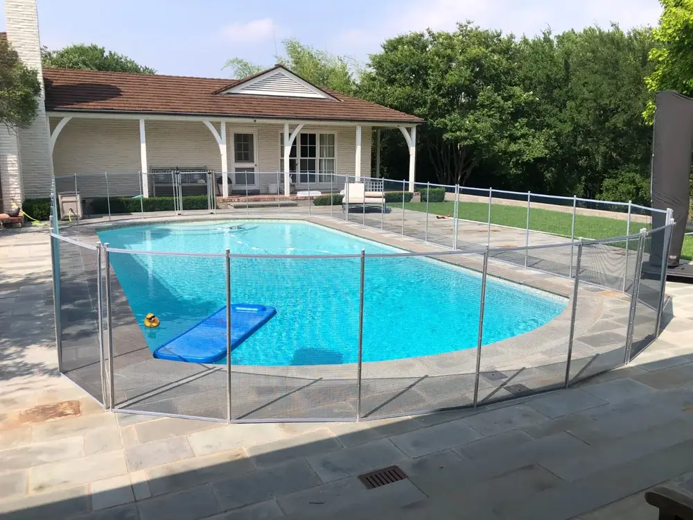 Gray mesh safety fence with silver poles