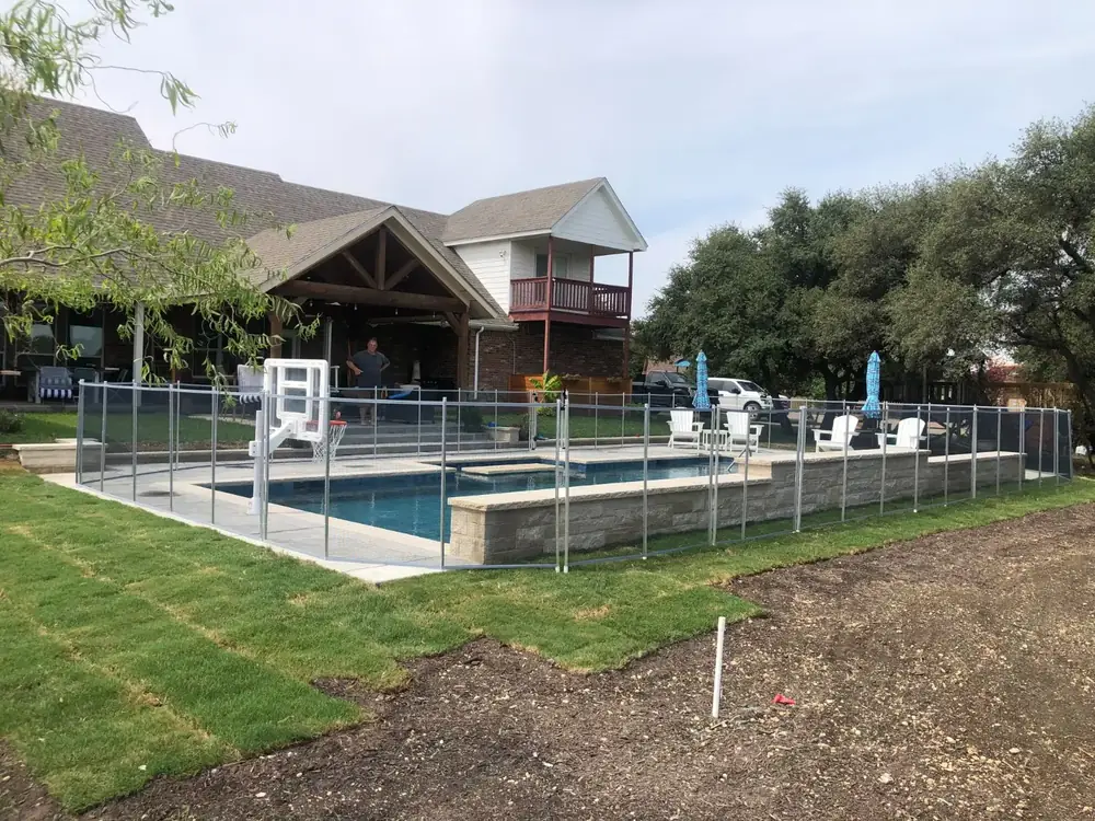 Gray mesh safety fence with silver poles