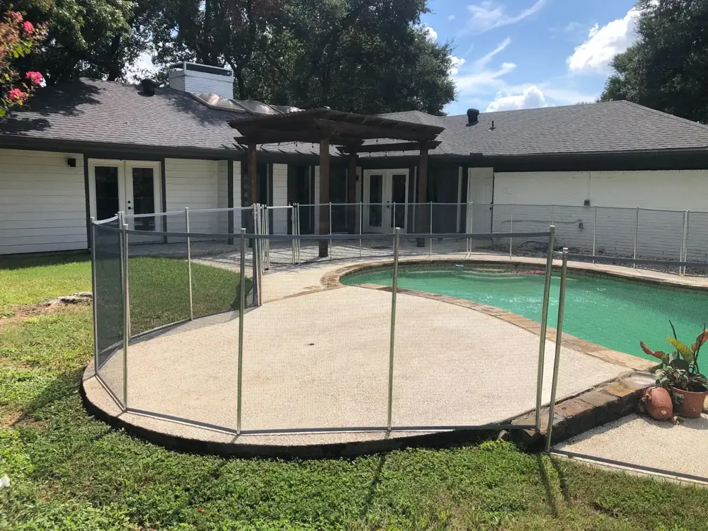 Gray mesh safety fence with silver poles