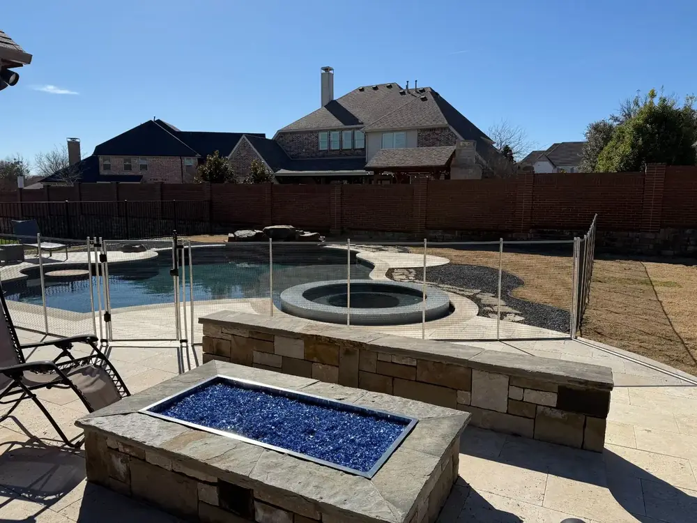 Gray mesh safety fence with silver poles