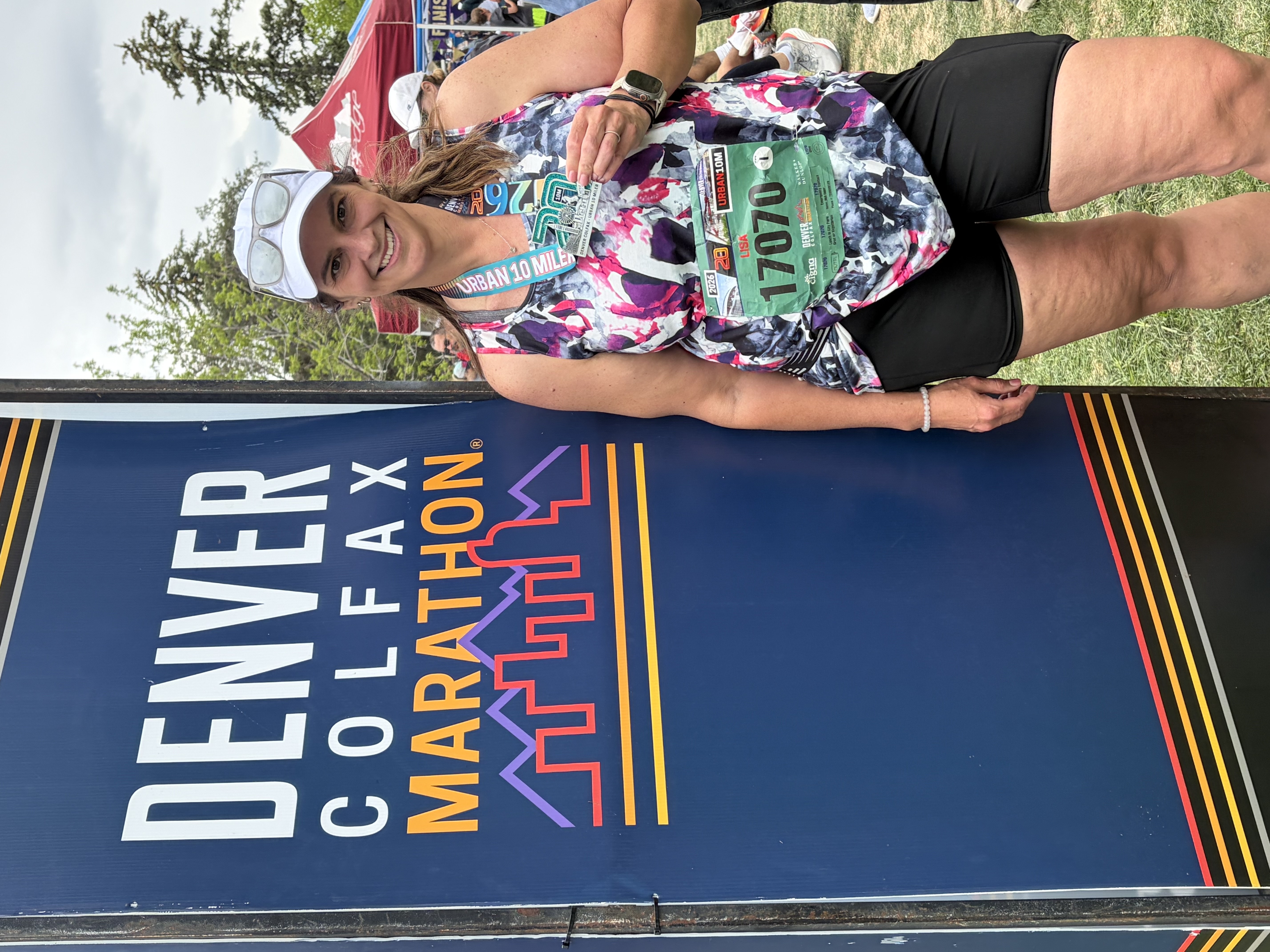 Lisa with her medal at the Denver Colfax Marathon race weekend