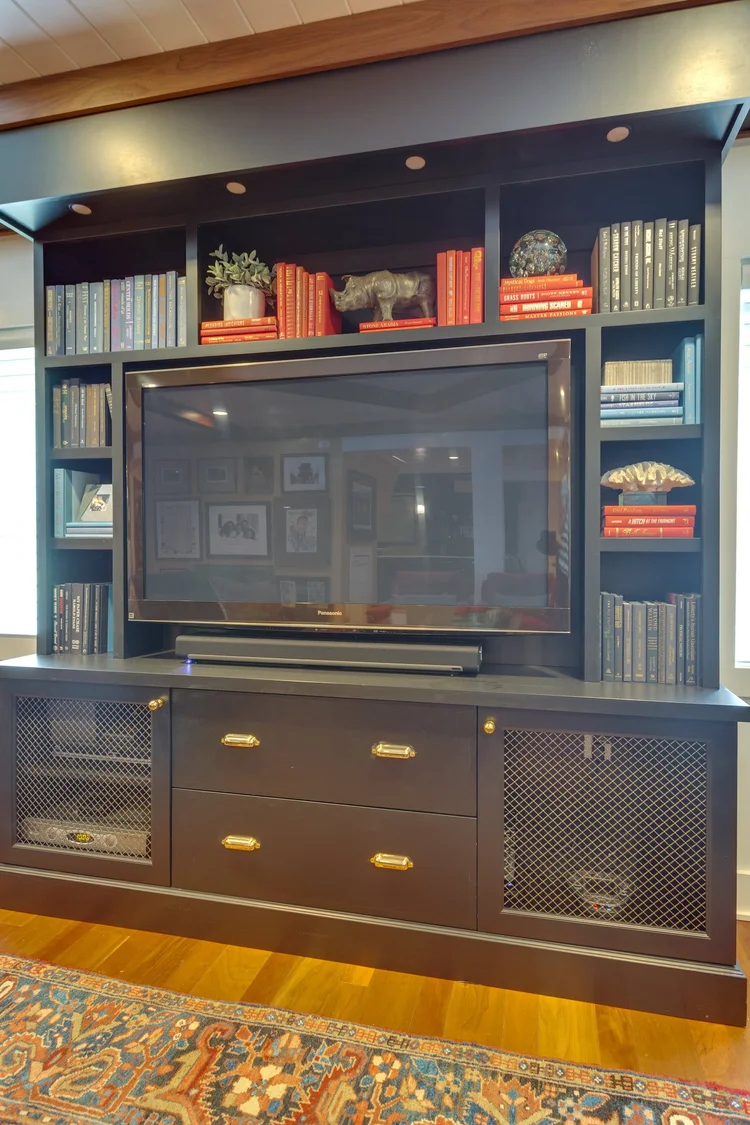 A finished luxury primary bathroom in a McLean, Virginia home, featuring a custom wet zone with a freestanding soaking tub, floor-to-ceiling tile work, and built-in cabinetry with integrated lighting. The space reflects a high-end design and build project completed by Wine Cellar Company for a Northern Virginia residential property.