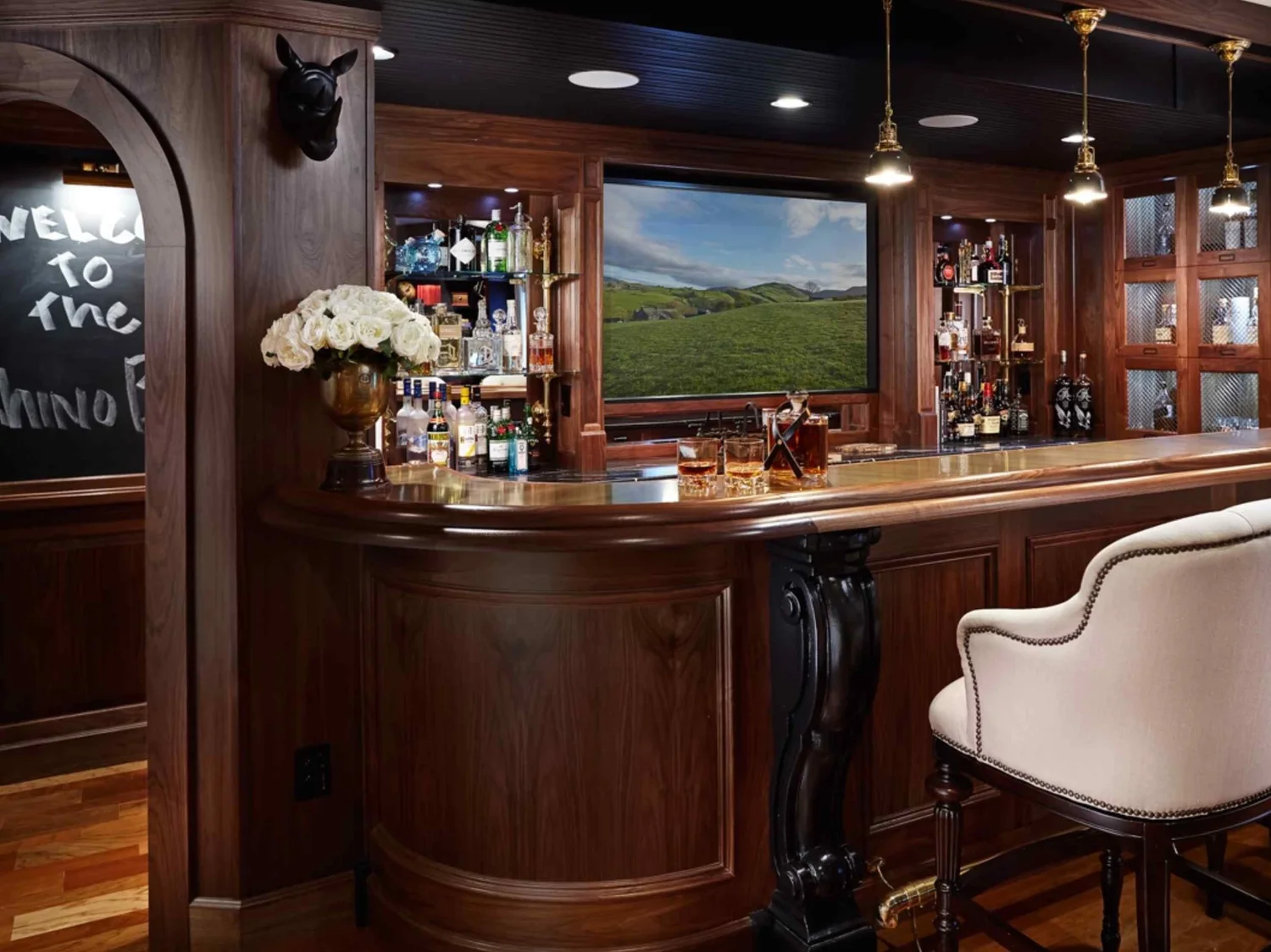 High-end wine cellar interior with custom millwork, temperature control systems, and luxury finishes.