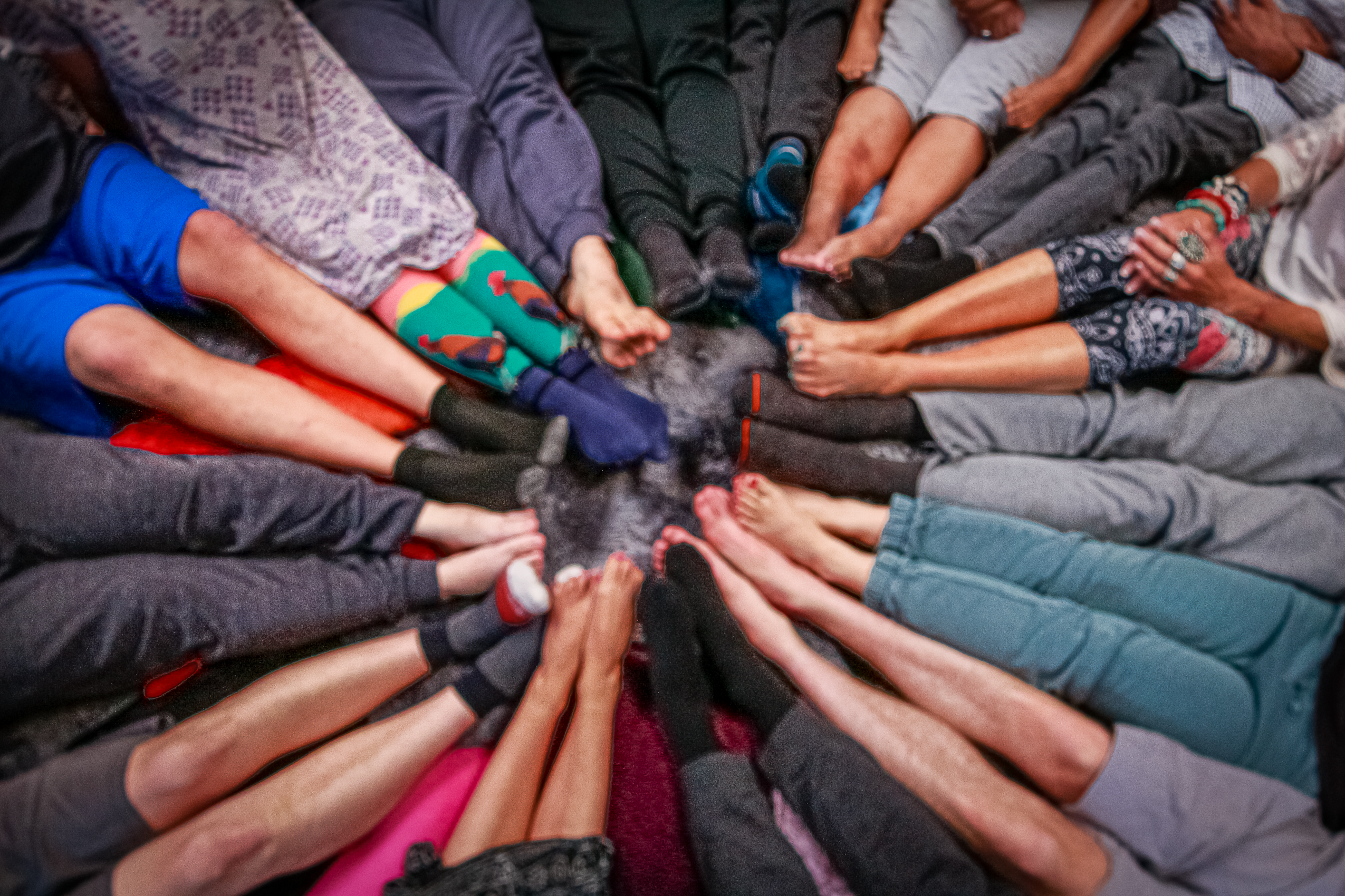 Community circle — feet touching in the center