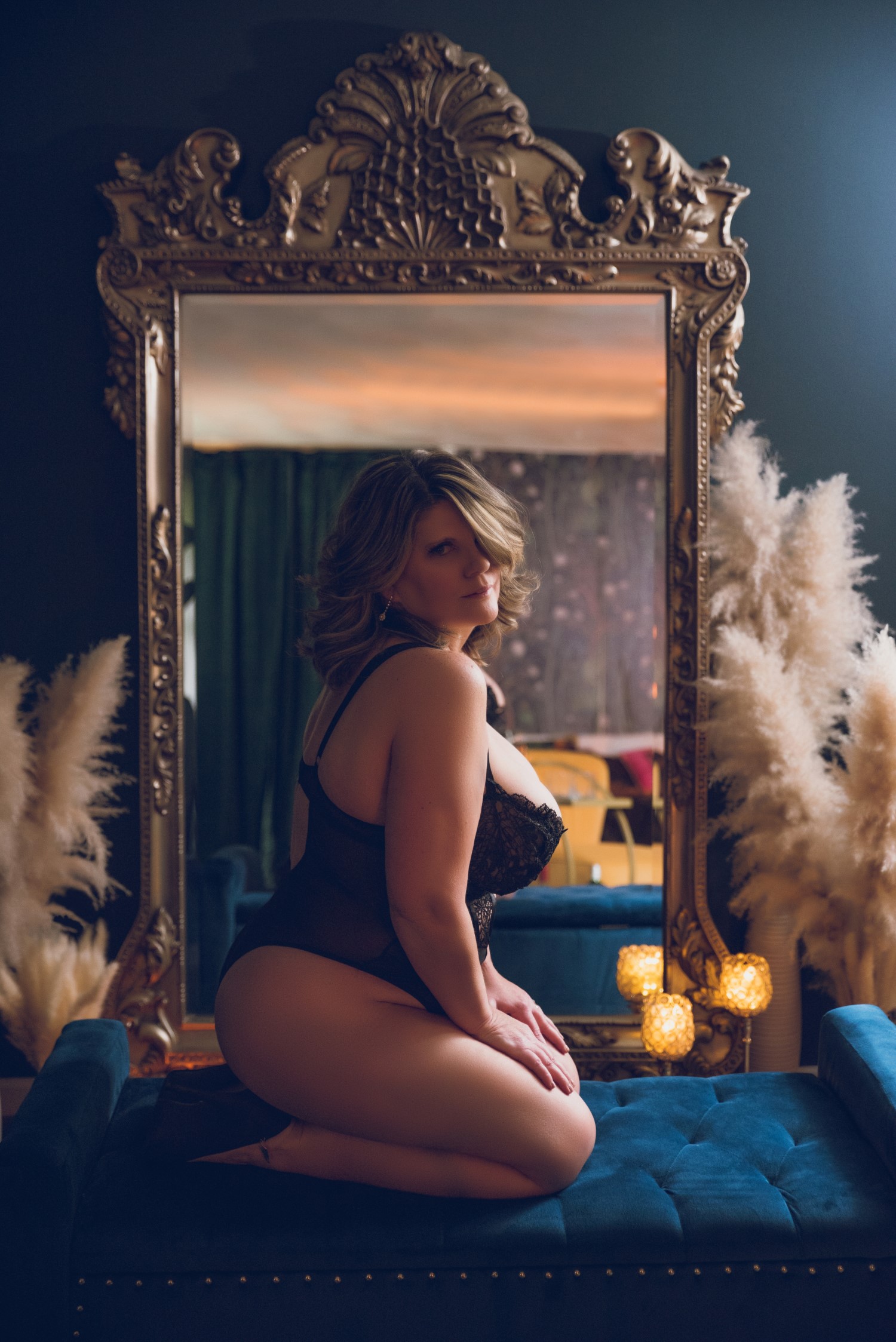 woman posing in front of mirror