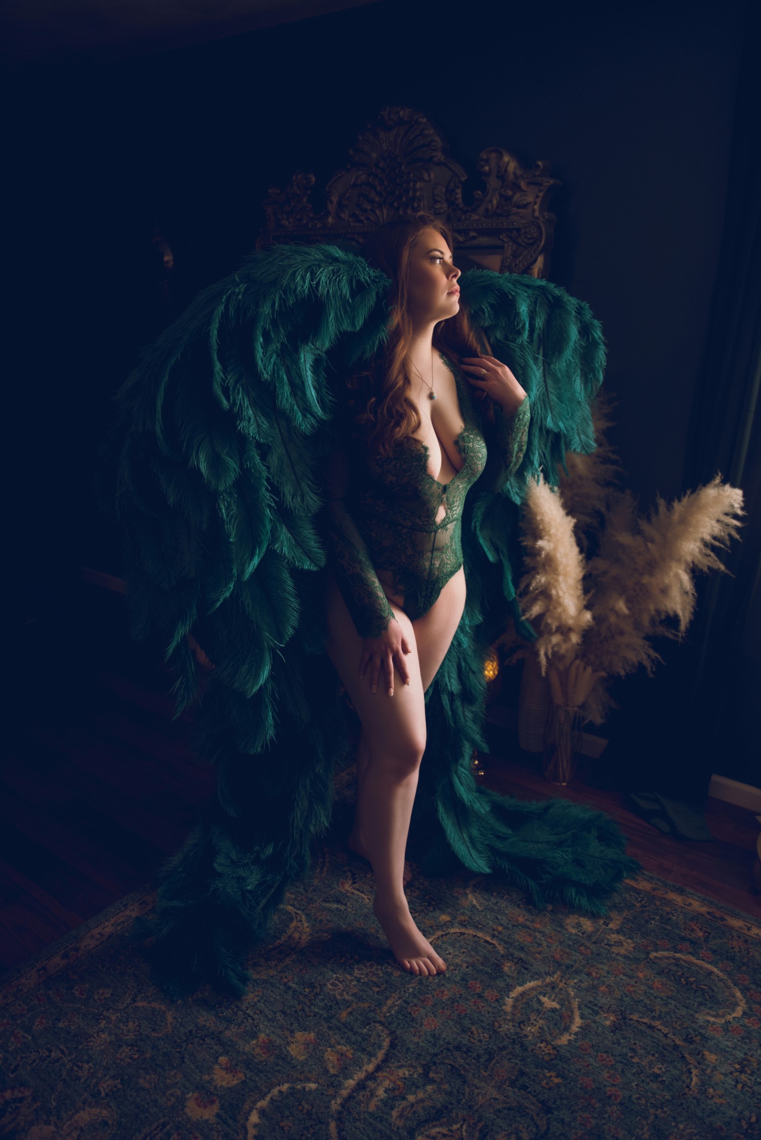 woman wearing green feathered wings