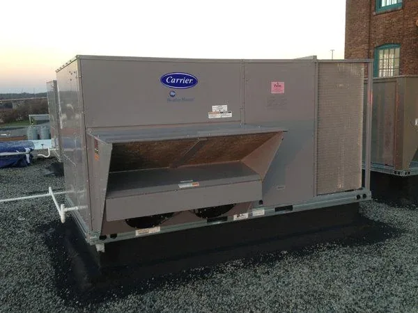 Commercial rooftop unit freshly installed on a flat roof