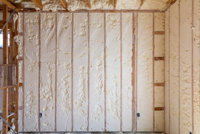 Closed-cell spray foam insulation boosting energy efficiency in Panama City FL by Blue Line Insulation