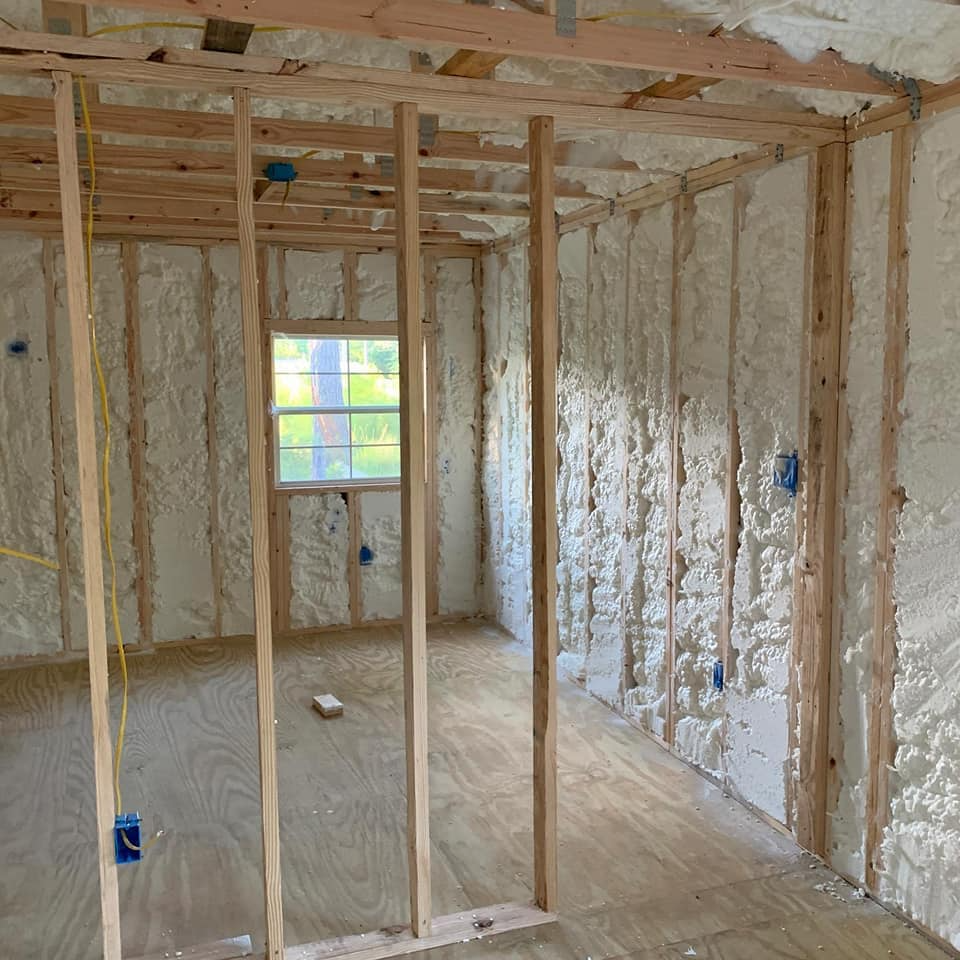 Closed-cell spray foam insulation applied to wall studs in Rosemary FL by Blue Line Insulation