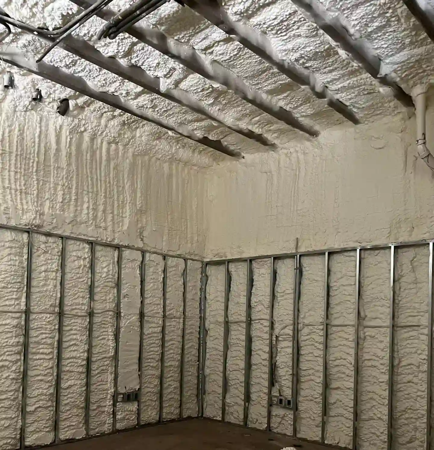 Expert open-cell spray foam insulation on metal framing in Panama City FL by Blue Line Insulation