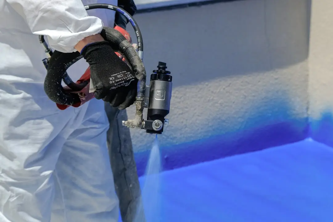 Applying intumescent fireproof coating to flat surface in Port Saint Joe FL by Blue Line Insulation